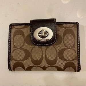 Coach Willie Turnlock has Brown and Tan Wallet